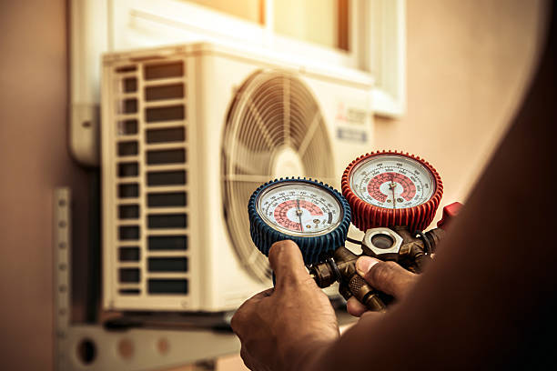 Professional Air Conditioning Service technician working in Hallsboro, NC